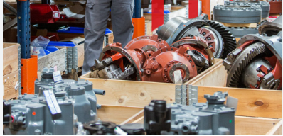 Technician performing industrial repair in workshop
